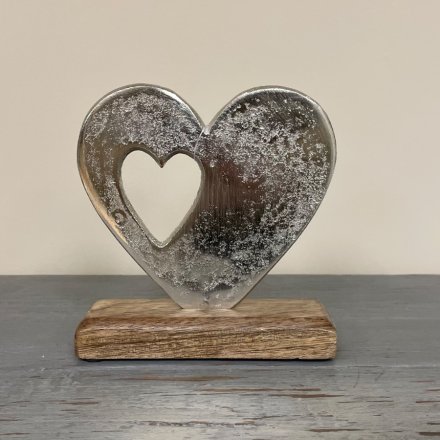  A beautifully simple aluminimum double heart feature set on a natural wooden block base 
