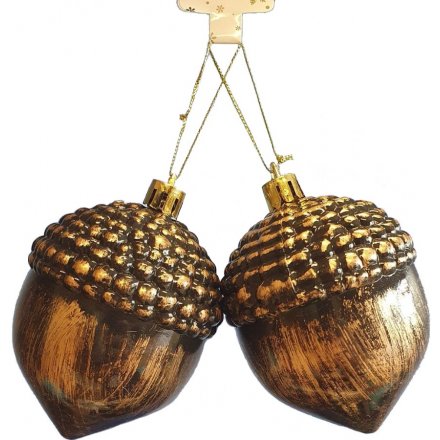 A sleek and simple hanging acorn tree decoration set in a tarnished bronze tone 