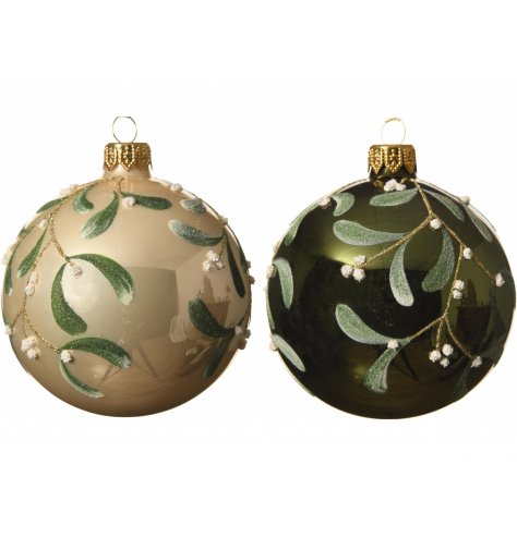 Christmas green and cream champagne glass baubles decorated with a shimmering glitter mistletoe design. 