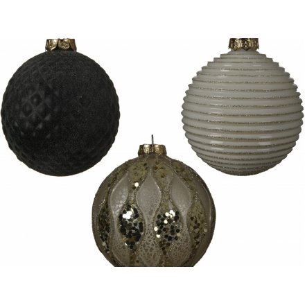  An assortment of luxe inspired glass baubles, each decorated with its own tone and ridged design 