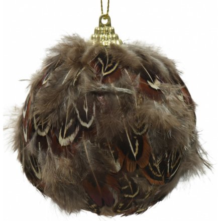 A luxe themed bauble covered with brown bird feathers 