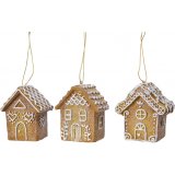 A delicious looking assortment of Gingerbread houses each decorated with glittery icing trimmings 