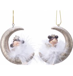 An assortment of hanging glittery moon decorations with seated fairies sat on them 