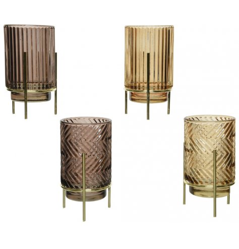 Art deco inspired glass candle holders in luxury gold and brown hues. Each has an elegant ridged pattern