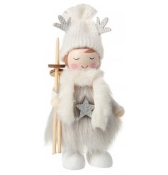 A charming little wooden girl decoration complete with wooden skis and glittery extras 