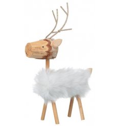 A small decorative standing wooden reindeer decorated with glittery metal antlers and a fluffy faux fur body 