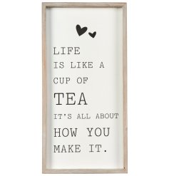 A tall standing printed quote with a natural wooden frame