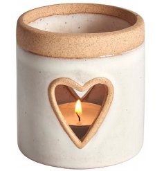 A sleek ceramic based tlight holder with a heart cut detail and added stone effect trimming 