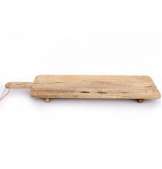 A distressed natural wooden serving board with feet and a hanging chunky string 