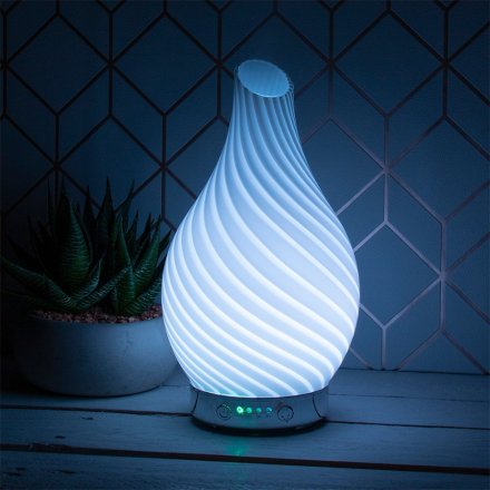  Decorated with a gorgeous blue wave design, this Humidifier also features a calming colour changing LED fitting inside 