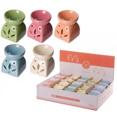 A colourful variety of small oil burners with a leaf cut decal to each 