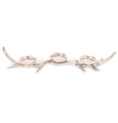 Make a statement with this attractive, textured antler decoration with three candle holders.