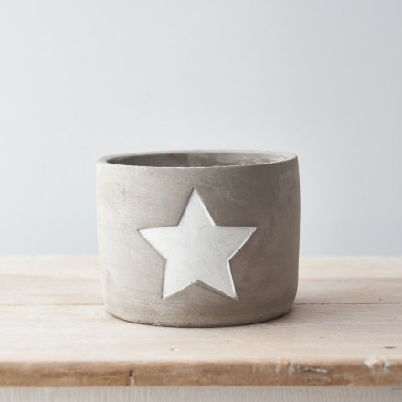 A large cement planter with a chic white painted star.