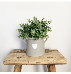 A chic grey pot with twin ears, complete with a pretty white heart design. 