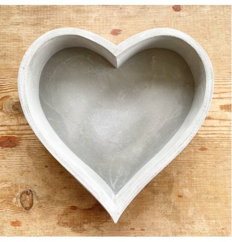 A rustic and raw cement heart tray with plenty of character and charm.