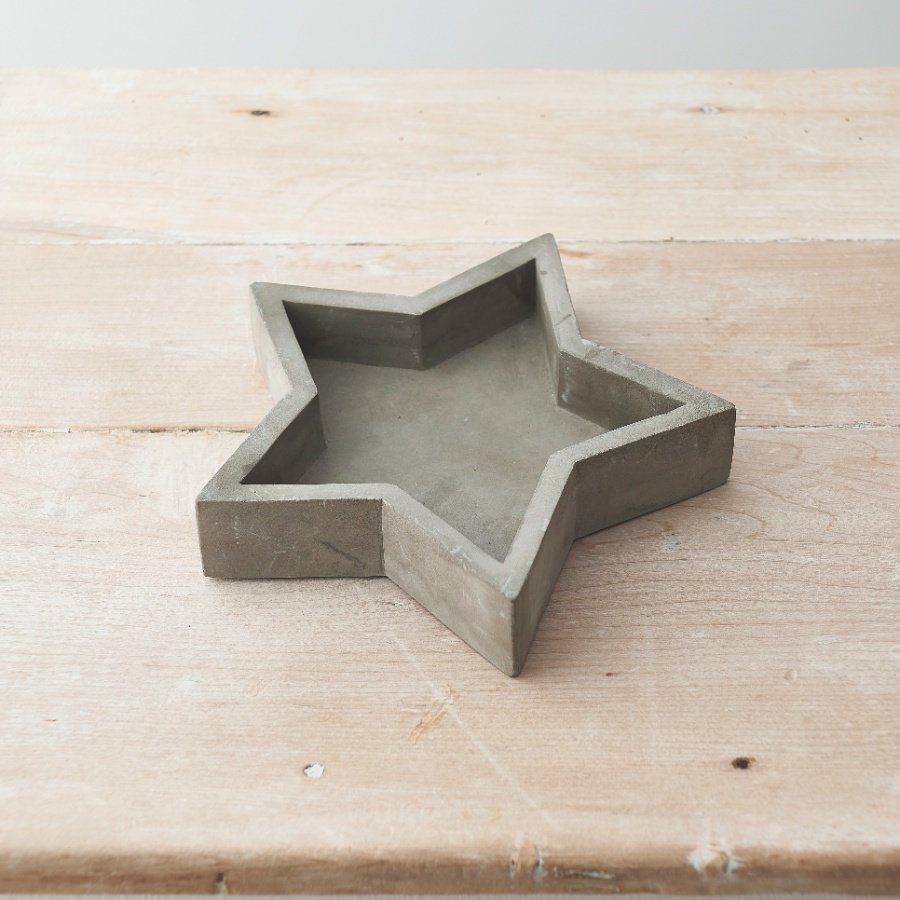 An effortlessly chic cement star tray with a raw and rustic finish.