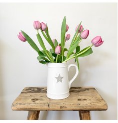A chic white ceramic jug with a grey star decoration.