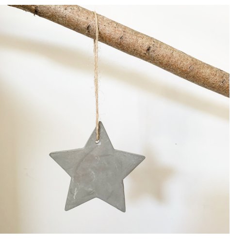 A rustic cement hanging star decoration with jute string. On trend and effortlessly stylish.