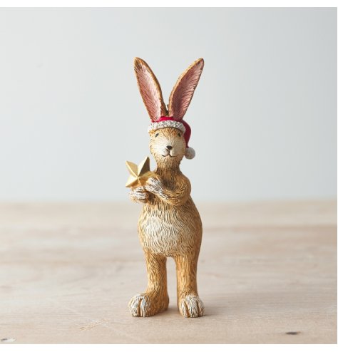 A beautifully detailed standing rabbit decoration. Complete with Santa hat and gold star.