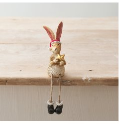 A cute and wonderfully festive shelf sitter rabbit with Santa hat, boots and gold star.