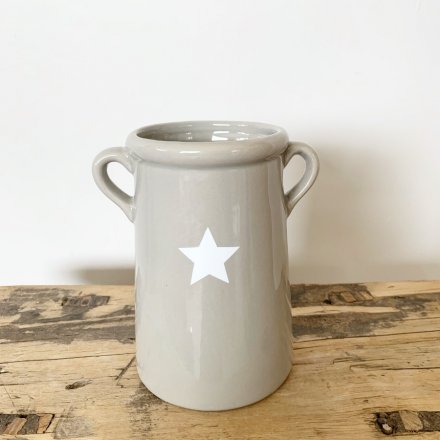 A simple, but perfectly formed grey vase with a white star shaped decal. Complete with twin handles.