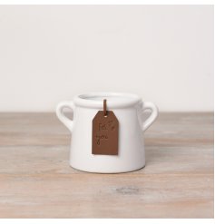 A classic white ceramic pot with small eared handles. Complete with a stylish PU leather tag in tan. 