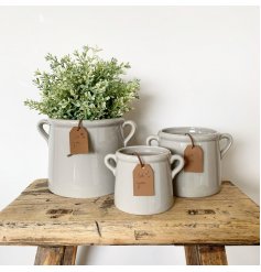 A rustic living grey pot planter with twin handles. Complete with a stylish PU leather tag which reads 'for you'.