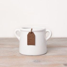 A beautiful and stylish ceramic pot in white. Complete with a PU leather tan coloured tag.
