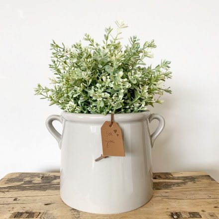 A simple yet beautifully formed pot planter, complete with small eared handles. 