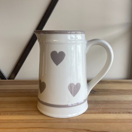 A beautiful and classic ceramic jug with a washed grey heart pattern.