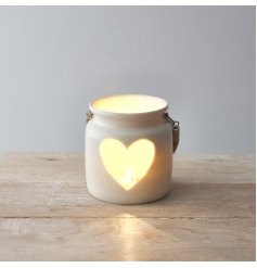 A chic t-light holder with a heart shaped cut out design. Complete with a chunky rope handle.