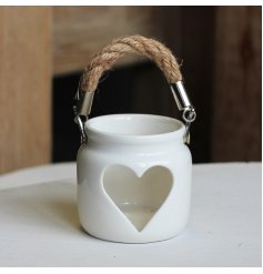 A chic and beautifully simple t-light holder with a heart shaped cut out design and chunky rope handle.