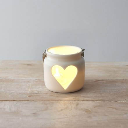 A beautifully simple lantern with a heart shaped cut out design. Complete with chunky rope handle.