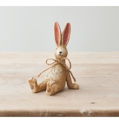 A charming and beautifully simple sitting rabbit ornament. Complete with a jute string bow and textured finish.
