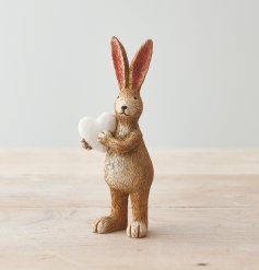 A charming standing rabbit ornament with tall pointed ears and a white heart.