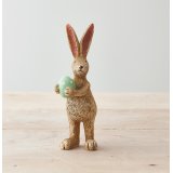 A charming and unique standing rabbit decoration, complete with a green polka dot egg.