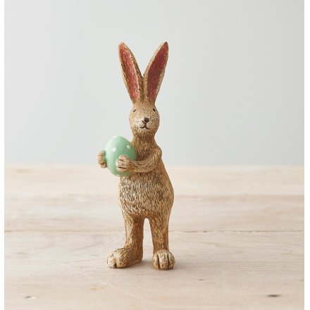 A unique and utterly charming rabbit decoration, complete with a green polka dot egg.