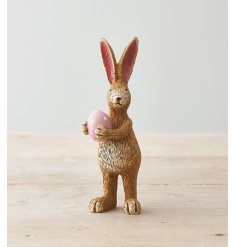 A pretty standing rabbit decoration, complete with a pink polka dot egg.