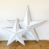 A vintage inspired metal barn star with black detailing and a distressed finish. Complete with hook to hang if desired.