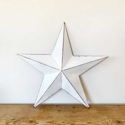 A vintage inspired white metal barn star with a distressed finish.