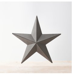 A vintage inspired grey metal barn star with distressed detailing on each three-dimensional point.