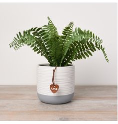 A chic and stylish pot with a ribbed surface finish. In grey and white block colours, complete with PU Leather tag.