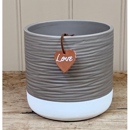 A chic and stylish two tone ceramic pot with added ridged decals and a heart shaped faux leather tag 