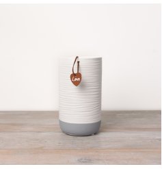 A chic and contemporary white and grey vase with a beautifully textured surface.
