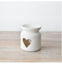 A chic ceramic oil burner in white with a heart shaped cut out design. Perfect for your most loved wax melts.