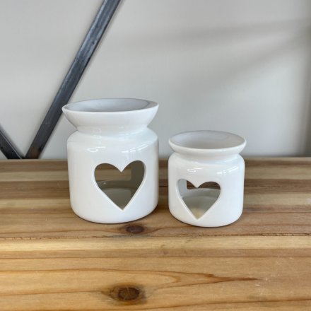A chic ceramic oil burner with a heart shaped cut out design. 