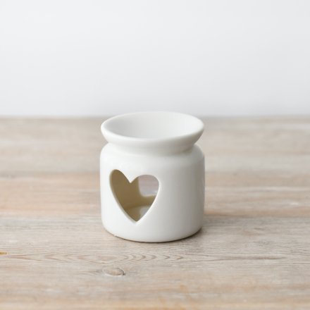 A chic ceramic oil burner with a heart shaped cut out design. 