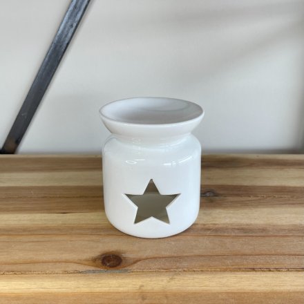 A chic and stylish oil burner in white, complete with a star shaped cut out design.