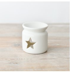 A chic and stylish oil burner in white, complete with a star shaped cut out design.