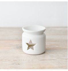 A chic and stylish ceramic oil burner in white. Complete with a star shaped cut out design.